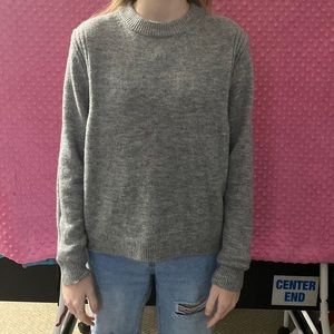 grey woman’s thin sweater